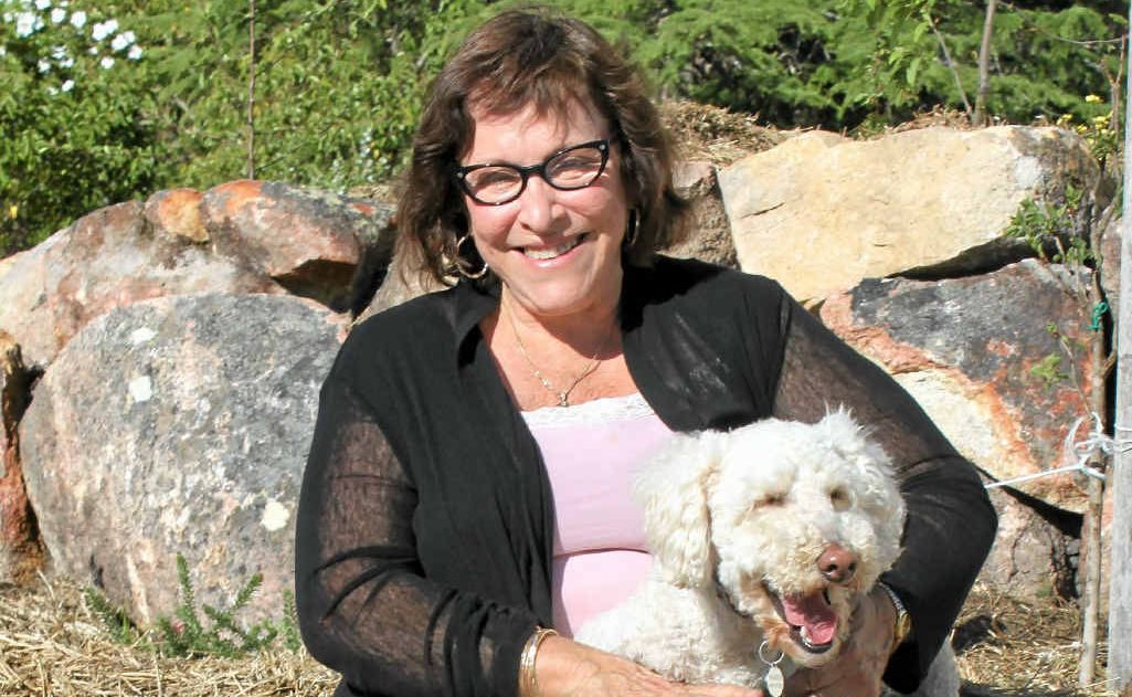 SITTING PRETTY: Helen Derbyshire and labradoodle Hugo enjoy the Granite Belt lifestyle. SITTING PRETTY: Helen Derbyshire and labradoodle Hugo enjoy the Granite Belt lifestyle.